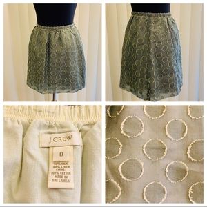 J. Crew green polka dot silk mini skirt.